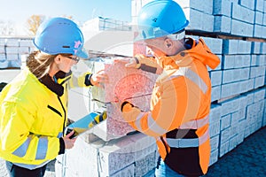 logistics worker with construction material to be transported