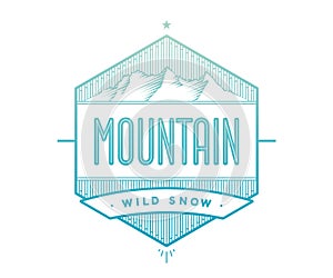 Logo badge for creative design project. Label related to mountain theme - blue mountain on a white background.