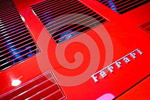 Logo of Ferrari horse on a cowl of sport car