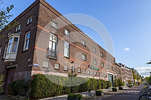 Logo of Heineken, the famous Dutch beer on a traditional brick wall in Amsterdam, Nl