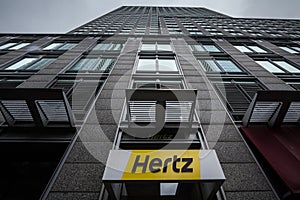 Logo of Hertz on their main office for Montreal, Quebec. Hertz is a car rental company from the USA spread worldwide