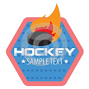 The logo of the hockey club or competition with the image of a hexagon and fire pucks