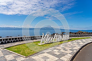 Logo, letters of the parish of Velas SÃ£o Jorge, view of the island of Pico. photo