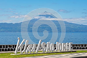 Logo, letters of the parish of Velas SÃ£o Jorge, view of the island of Pico. photo