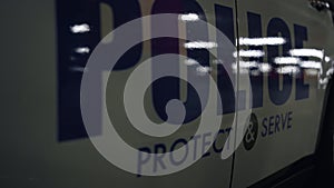 Logo on police department car in details. Closeup modern police car with emblem