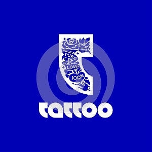 Logo with traditional tattooing style elements on T letter