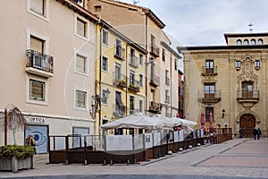 LogroÃ±o, La Rioja, Spain. April 22, 2018: Small square in the old part of the city with a terrace of a bar with people drinking a