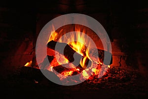 Logs burning in fireplace photo