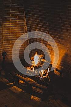 Logs burning in an old fireplace