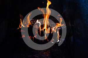 Logs and coal on fire photo