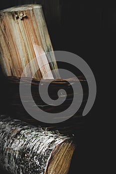 Logs on a dark background. Sawn wood. Birch tree