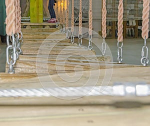 The logs on the ropes as an obstacle in the adventure Park