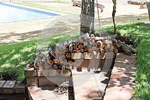 Logs stacked on patio