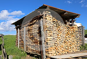 logs of a woodpile in the Woodshed