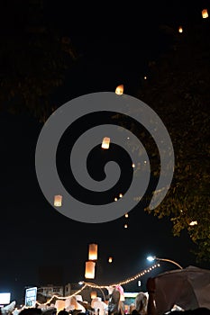 Loi Krathong and Yi Peng released paper lanterns on the sky during night