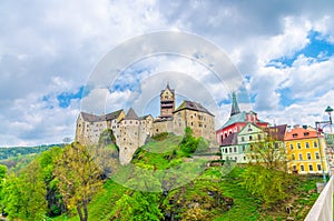 Loket Castle Hrad Loket gothic style building on massive rock and colorful buildings in Loket town