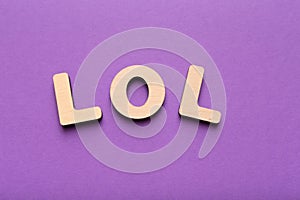 LOL abbreviation spelled with wooden letters