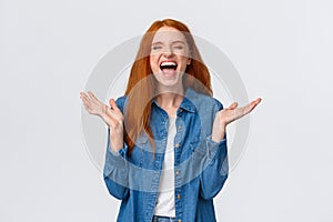 Lol so funny. Amused and carefree pretty redhead female student clap hands, applause with closed eyes as laughing out