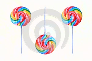 Lollipop, Colorful rainbow lollipop swirl on plastic stick isolated on white background.