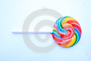 lollipop, Colorful rainbow lollipop swirl on plastic stick isolated on white background.