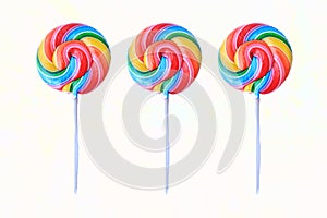 lollipop, Colorful rainbow lollipop swirl on plastic stick isolated on white background.