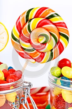 Lollipops, candy and chewing gum in the jar