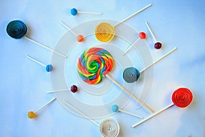 Lollipops on clouds background with paper lolly pops