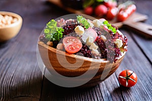 Lollo rosso salad with chickpeas, tomato, radish and croutons photo