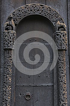 Lom medieval stave church door detail. Norway tourism