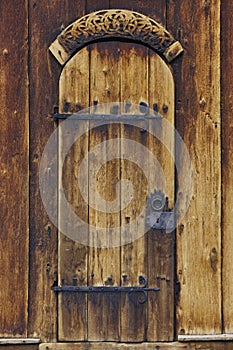 Lom medieval stave church door detail. Viking symbol. Norway