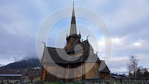Lom Stavkirke stave church in autumn in Norway