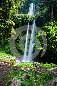 Lombok, Tiu Kelep waterfall in Senaru, Lombok, Indonesia. Tourists from overseas were enjoying the waterfall.