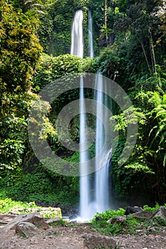 Lombok, Tiu Kelep waterfall in Senaru, Lombok, Indonesia. Tourists from overseas were enjoying the waterfall.