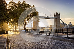 London in autumn season: golden sunrise behind the Tower Bridge