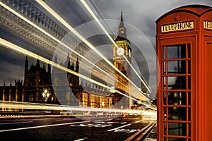 London with Big Ben and red Phone Booth during evening in England, UK