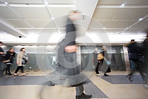 London businessman train tube station in rush hour