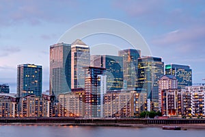 london Canary wharf at dusk view from thames river