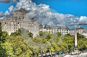 London city scene with Savoy Hotel and Cleopatras Needle photo