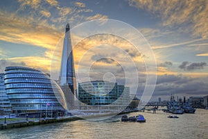 London City skyline along River Thames during vibrant sunset
