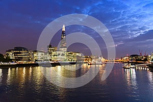 London city skyline and River Thames, UK, in the dusk evening