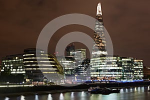 London cityscape with city hall and the Shard at night