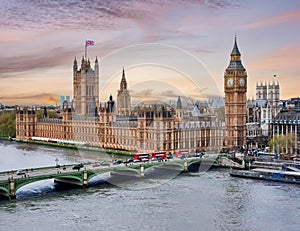 London cityscape with Houses of Parliament and Big Ben tower at sunset, UK