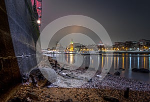 London cityscape from Thames beach at low tide
