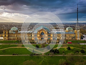 London, England - Aerial panromaic view of Alexandra Palace in Alexandra Park with iconic red double-decker bus