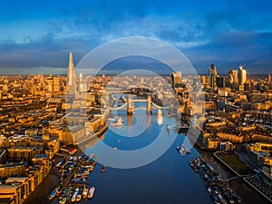 London, England - Aerial skyline view of London including iconic Tower Bridge with red double-decker bus