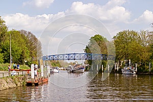 London, England - April 6 2013 : People enjoying  a warm spring day on a tour boat on River Thames near Teddington, on April 6 photo