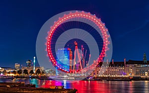 LONDON, ENGLAND - AUGUST 22, 2016: London Thames River and Spinning London Eye. Long Exposure Photo Shoot. Late Evening.