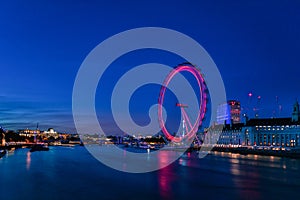 LONDON, ENGLAND - AUGUST 22, 2016: London Thames River and Spinning London Eye. Long Exposure Photo Shoot. Late Evening.