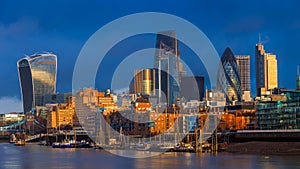 London, England - Beautiful dramatic sky and golden hour sunlight at Bank District of London