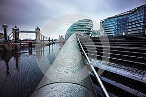 London, England - Dark rainy day in the center of London with office buildings and Tower Bridge